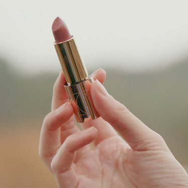 Close shot of a DOUGLAS lipstick in a hand